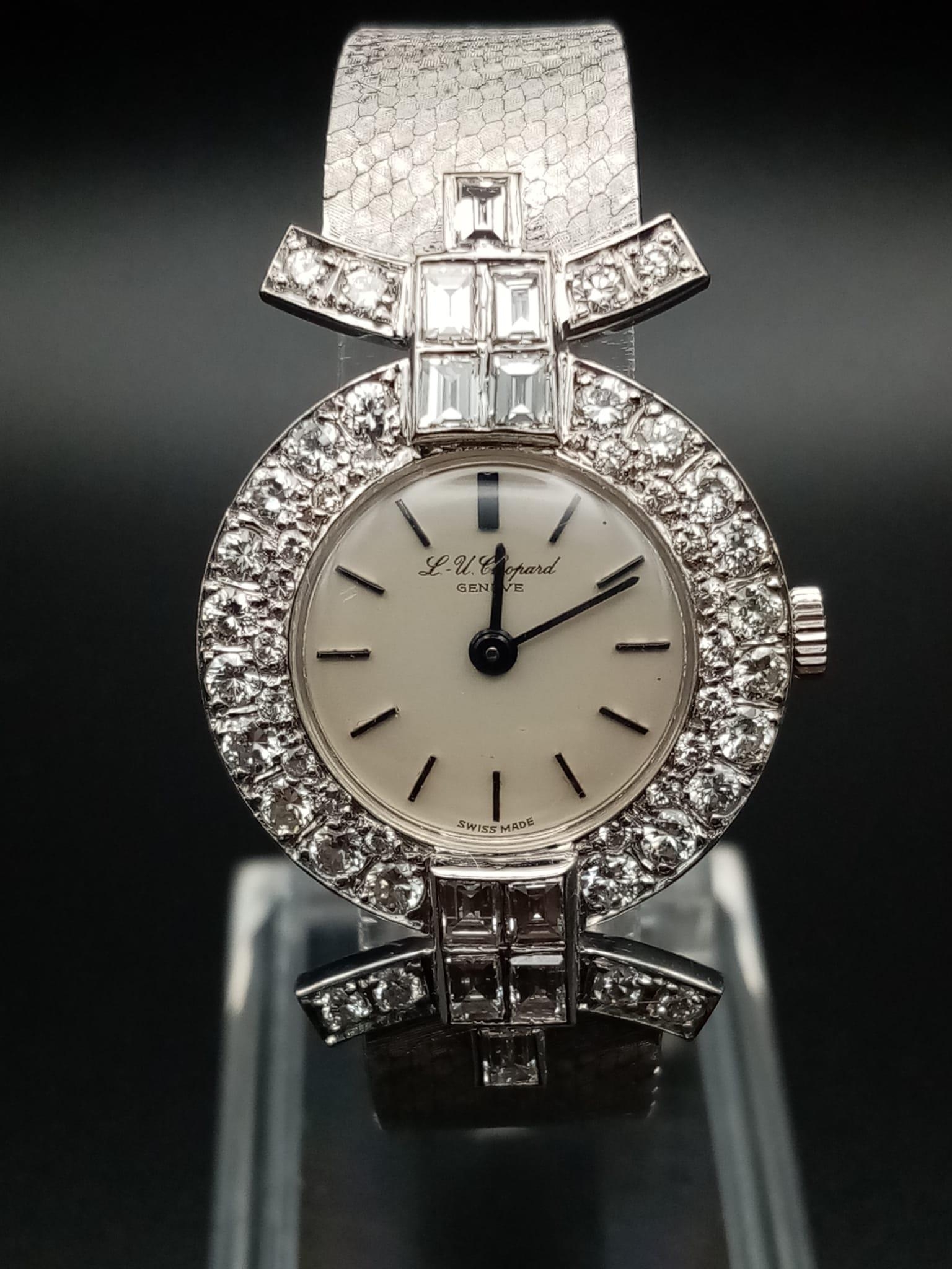 A Chopard 18K White Gold and Diamond Ladies Watch. White gold strap and case - 25mm diameter.