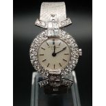 A Chopard 18K White Gold and Diamond Ladies Watch. White gold strap and case - 25mm diameter.