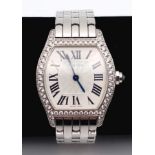 A Cartier 18K Gold and Diamond Tortue Ladies Watch. 18K gold bracelet and case - 25mm. White dial.