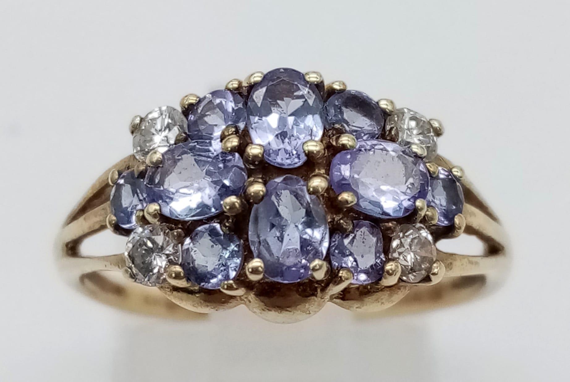 A 9K Yellow Gold Amethyst and White Stone Cluster Ring. Size P. 2.43g total weight.