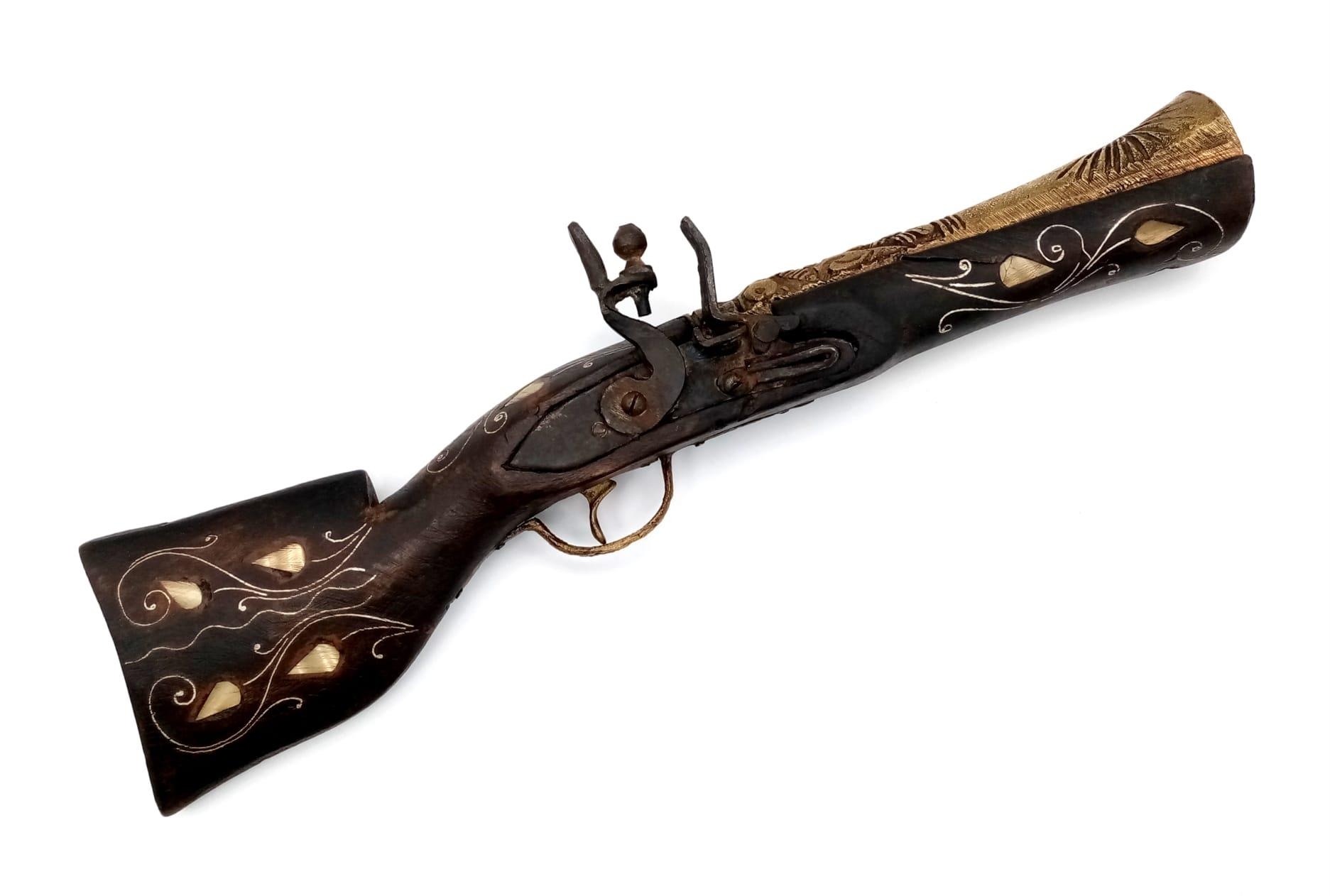 A Vintage Decorative Wood and Metal Eastern Blunderbuss Flintlock with Inlaid Mother of Pearl.