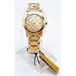 A rare and beautiful, BURBERRY, THE CITY, ladies watch with engraved check bracelet. 27mm case,