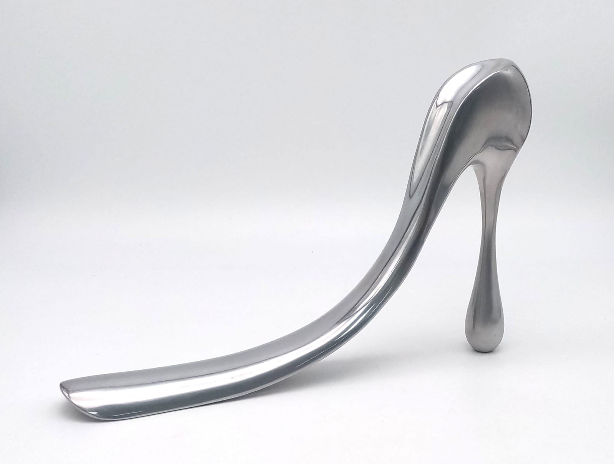 A rare aluminium shoe-horn of large proportions designed and signed by MANOLO BLAHNIK. Manuel (