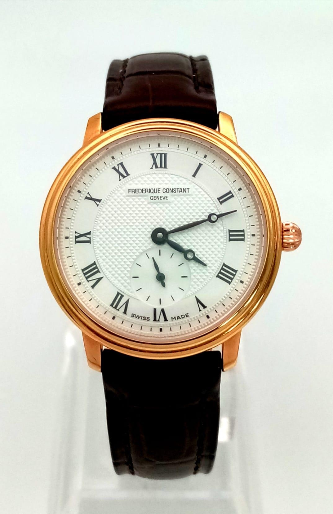 A Frederique Constant Ladies Slimline Watch. Brown leather strap. Gold plated case - 28mm. White