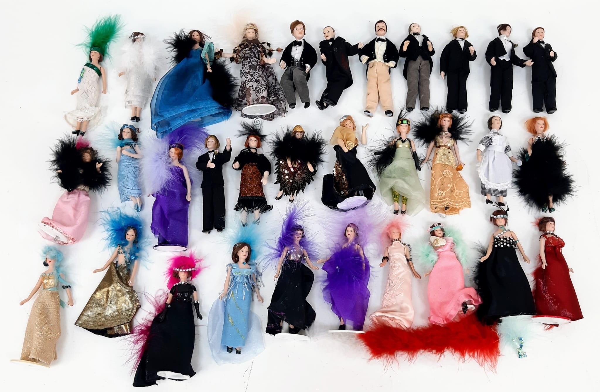 A collection of 32 dollhouse characters. All dressed in 1920's clothes - perfect for an Agatha