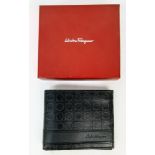 A SALVATORE FERRAGAMO MENS NEW AND UNUSED LEATHER WALLET IN ORIGINAL BOX.