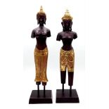 A pair of very ornamental, partly gilded, Thai prince and princes from the second half of 20th