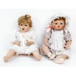 A pair of porcelain dolls from The Hamilton Collection -with makers marks to the back of their