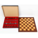 An AJ Edrez Napoleon Themed Metal Chess Set. 16 white and 16 red coloured pieces. Comes with case