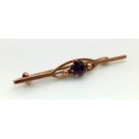 An Antique Victorian 9K Rose Gold and Amethyst Bar Brooch. 5cm. 1.89g total weight.