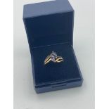 9 carat GOLD and TANZANITE RING having three Tanzanite stones set to top in modernist style. 2.5