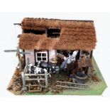 A rustic old barn dollhouse. Incredible detail and accessories including a hand thatched roof!