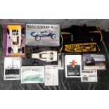 Two vintage, 1980's radio controlled cars with transmitters and Beatties carry bag. A Tamiya