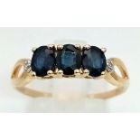 10k Yellow Gold Ring With Trilogy Of Sapphire and Diamonds on Shoulders. 2.1grams Size S.
