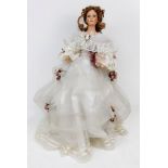 A beautiful bridal porcelain doll. Unmarked and in excellent condition. 50cm