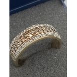 9 carat GOLD and DIAMOND RING,having four rows of CHAMPAGNE DIAMONDS and WHITE DIAMONDS in half