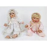 A pair of porcelain dolls - An Ashton Drake plus an unmarked doll. In excellent condition. 50cm