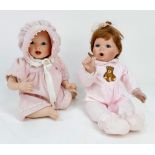 A pair of Ashton Drake 1997 and 99 real life porcelain dolls. In excellent condition. 50cm.