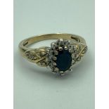 Vintage 9 carat GOLD RING set with SPINEL and DIAMONDS. Having dark blue Spinel mounted to top