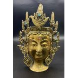 A Vintage Chinese Patinated Bronze Deity Head with Multi Coloured Cabochons. 25.5cm Tall.