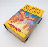 A hardback first edition of Harry Potter and the order of the Phoenix with dust cover. Excellent