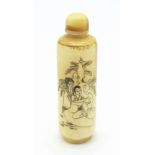 An early to mid 20th century Chinese bovine snuff bottle with an erotic picture engraved on the