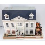 A beautiful Georgian dollhouse - The Oaks. Fully decorated and fitted out. It is fully wired and