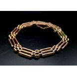 A Vintage 9K Gold Gate Bracelet with Safety Chain. 18cm. 10.56g