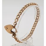 A Vintage 9K Yellow Gold Curb Link Bracelet with Heart Clasp. 18cm. 10.63g