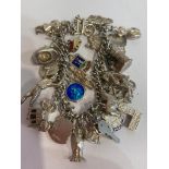 Vintage SILVER CHARM BRACELET, having a large varied assortment of approx 35 SILVER CHARMS to