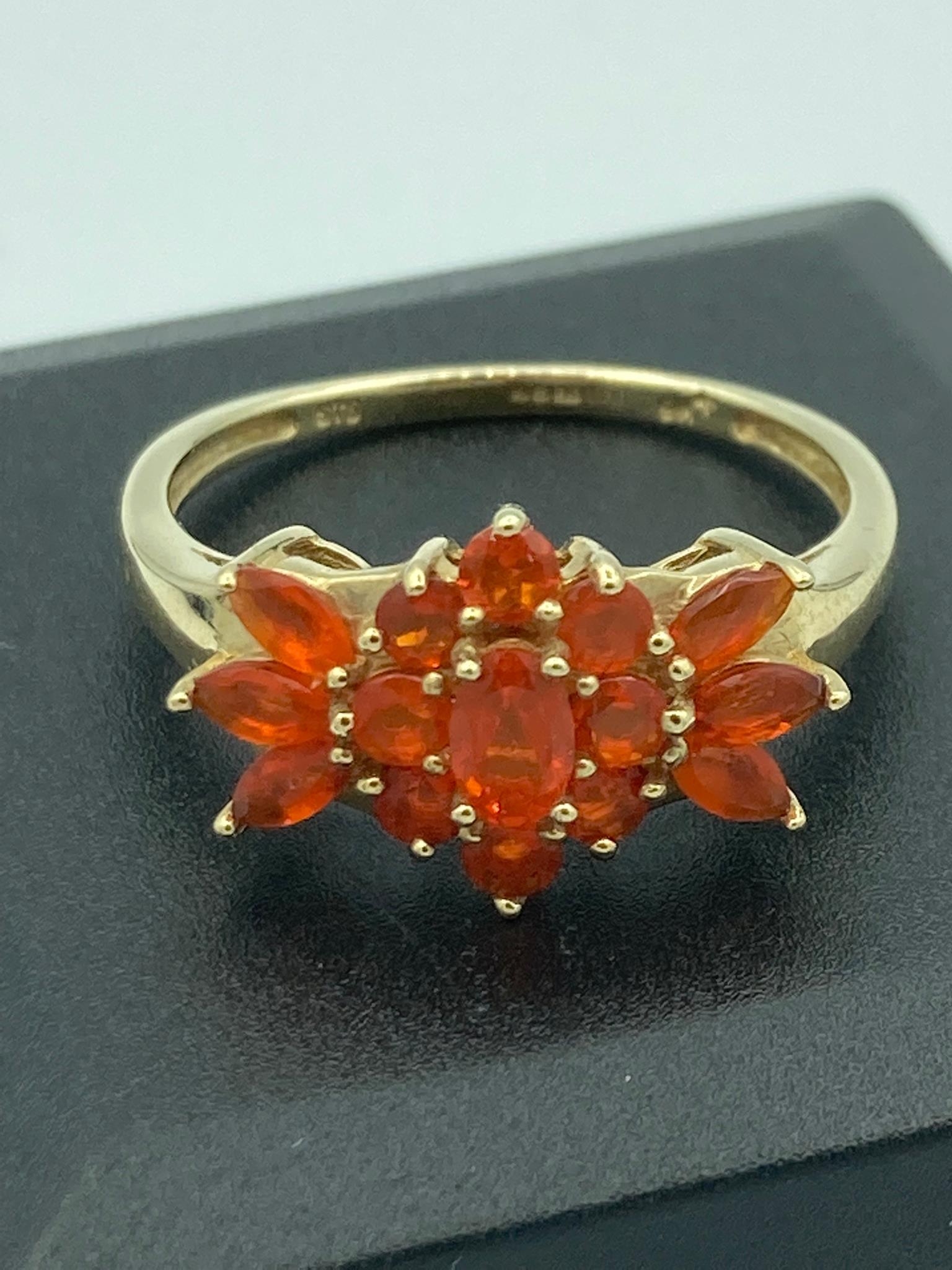 9 carat GOLD CLUSTER RING set to top with orange gemstones in attractive GOLD openwork Mount.2.77