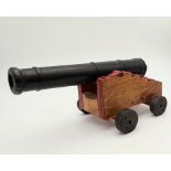 A Vintage Mid 20th Century Cast Iron and Wood Scratch Built Cannon 24cm Length.