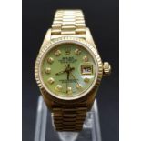 18K YELLOW GOLD LADIES ROLEX OYSTER PERPETUAL DATE JUST WATCH WITH MOTHER OF PEARL FACE AND