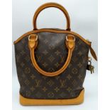 A Louis Vuitton Lockit Handbag. Monogram canvas and brown leather exterior. Lock with key. 25 x