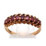 An Antique 9K Yellow Gold Ruby Half-Eternity Ring. Size M. Nine quality round cut rubies. 2.23g