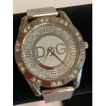 Ladies quartz wristwatch in silver tone with jewelled bezel,having large diamante surround dial.