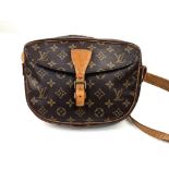 A Louis Vuitton Jeune Fille Crossbody Bag. Monogram canvas and brown leather. Large buckle-open