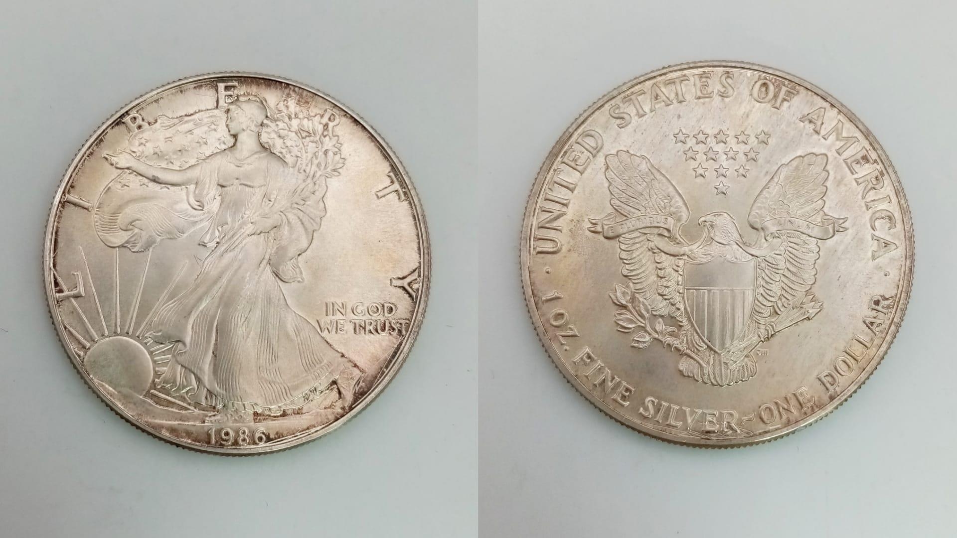 A USA 1986 Silver One Dollar Coin. 31.4g. In original presentation box.