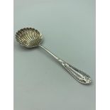 Antique SILVER SIFTING SPOON with a beautiful shell shaped bowl and having clear hallmark for
