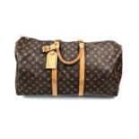 A Louis Vuitton Keepall - Bandouliere 55. Monogram LV brown canvas and leather. 55 x 31 x 26cm. In