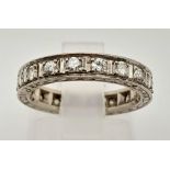 A Platinum Diamond Eternity Ring. 20 round cut diamonds. Size J. 3.74g total weight.