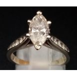 A 14K White Gold Marquise-Cut Diamond Ring. 1.5ct central stone with a further ten graduated round