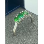 Beautifulm Hallmarked 9 carat WHITE GOLD RING with three oval cut GREEN TOURMALINE set to top. 2.2