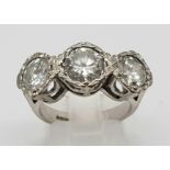 An 18K White Gold Diamond Trilogy Ring. 1.3ct. Size N. 8.16g total weight.