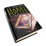 A hardback first edition of Harry Potter and the half blood prince with adult dust cover.