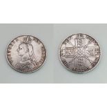 An 1890 Queen Victoria Double Florin Silver Coin. Good definition but please see photos.