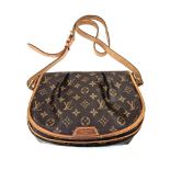 A Louis Vuitton Sling Bag. Monogram canvas and brown leather. Open front flap. Inner zipped