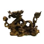 A Chinese Qing Dynasty Dragon with Pearl Ball Bronze. Inspired by the legend of the dragon and the