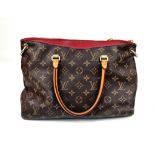 A Louis Vuitton Pallas Monogram Shoulder Bag. Brown monogram canvas and leather. Gilded hardware.