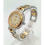A Hermes H Clipper Quartz Ladies Watch. Two tone strap and case - 24mm. Gold tone dial with date